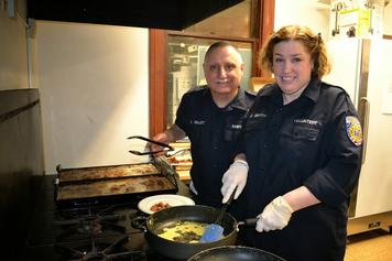 Steve and Whitney cooking breakfast